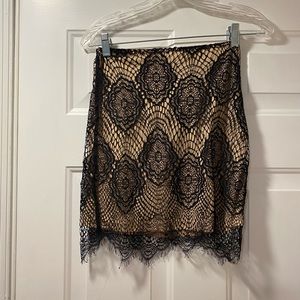 Mesh black and nude skirt.